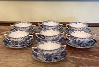 Overview of eight bowls and saucers arranged on a marble surface