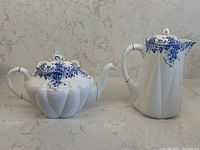 Front view of teapot and water jug side by side