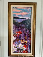 Full view of framed Canadian floral landscape painting with vibrant wildflowers and lake background