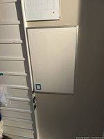 Full view of both white boards, showing the larger magnetic white board and the smaller white board calendar above it.