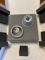 Swarovski Blue Flower jewel box in original box with foam protective inserts, showing the separated lid and base.