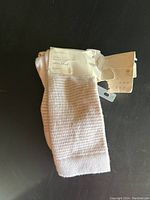 Photo of the six new cotton blend crew socks bundled with label showing brand A New Day.