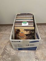 Box filled with assorted vinyl records showing front album cover featuring Beethoven's symphonies.