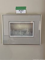 Close-up of the framed winter landscape print showing matting and frame.