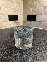Front view of glass showing 'We the People' and Constitution text etched on clear glass.
