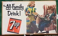 Full view of the 1953 litho cardboard sign with girl serving 7up bottles and boy in armchair with newspaper and large text