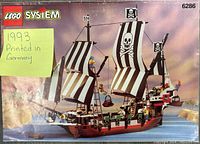 Front cover of the instruction manual showing the completed LEGO pirate ship with black and white striped sails featuring skull and crossbones, yellow sticky note indicating '1993 Printed in Germany'.