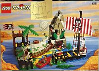 Front cover showing completed LEGO pirate island set 6281 with pirate ship, figures, and island features.
