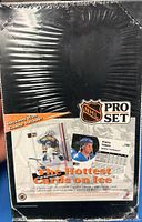 Front of the sealed 1991 NHL Pro Set hockey card box with logo, product images, and description of contents.