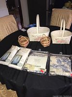 Overview of baskets and packaged curtains laid on table