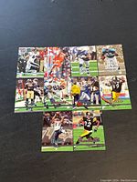 Photo showing nine 2006 Ultra football cards with various players in action poses.