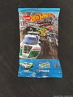 Front view of sealed Hot Wheels Mystery Models blind pack with colorful racing car graphics
