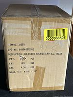 Box labeled as containing 36 Colorado Rockies cap ornaments, listing item number and measurements