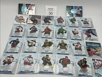 Photo showing all 26 hockey cards arranged in rows with variations in player images and serial numbers.