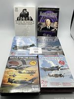 All six sealed DVD box sets arranged on a white surface. Titles include 'Total Romance: The Ultimate Collection', 'Master of Suspense', and four military aviation themed sets.