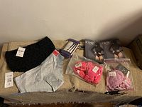 Overview of lingerie items including panties, tights, and lingerie sets in packaging.