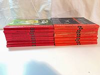 Stacked view of all 18 hardcover books showing spine titles