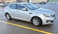Driver-side front three-quarter view of silver 2013 Kia Optima LX