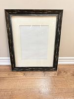 Front view of frame showing mat and glass
