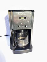 Front view of Cuisinart programmable coffee maker with glass carafe inserted