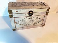 Front view showing woven diamond panel and latch