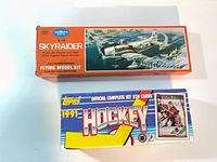 Guillows Skyraider model kit box and Topps 1991 Hockey set box side by side