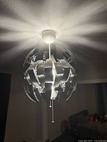 Lamp installed, panels partially open, illuminated