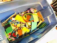 Top view of tote showing mixed LEGO bricks, plates and baseplates