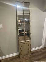 Front view tall mirror with paneled metal frame