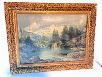 Framed alpine landscape painting front view