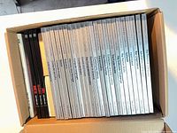 Cardboard box containing approximately 33 books; spines of Time Life series and assorted others visible