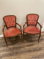 Both armchairs side by side showing overall design and wear