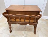 Front view of wooden magazine rack side table