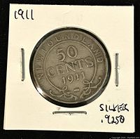 Obverse side of 1911 Newfoundland 50 cents coin showing denomination and year, handwritten notes indicating silver 925.0.