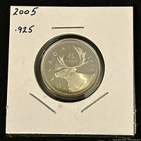 Front side of the coin showing a detailed image of a caribou with inscriptions CANADA 25 CENTS 2005.