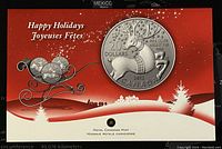 Image of the Royal Canadian Mint holiday packaging showing the coin design with a reindeer and holiday greetings.