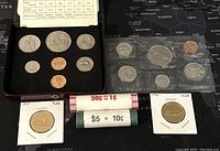 Image showing 1978 PL coin set in presentation box with six coins and two paper rolls of 2005 mint coins.