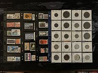 Photo showing over 180 assorted world postage stamps attached on black album pages, various designs and countries