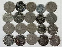 Photo showing assortment of Great Britain coins of various denominations and dates with designs featuring Queen Elizabeth II and other symbols.