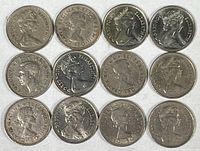 Top view showing obverse sides with Queen Elizabeth II profile on 12 five pence coins of varying dates and inscriptions