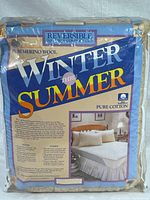Original packaged product showing product name 'Winter Thru Summer', highlighting reversible feature with pure merino wool for winter and pure cotton for summer side.
