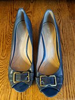 Top view of blue leather peep toe women's wedge shoes with buckle detail size 8.5