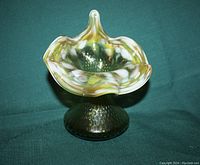 Front angled view of the green Jack in the Pulpit vase showing the art glass swirl colors and shape.