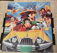 Full view of the cardboard cutout showing The Goofy Movie characters in a yellow car driving scene.