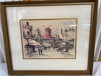 Framed watercolor lithograph showing overall piece with wooden frame and glass, wall-hung.