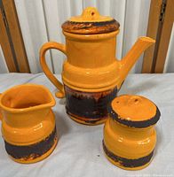 Full set of three fat lava style pottery pieces including the teapot, creamer, and sugar jar.