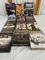 Full view of the DVD collection with titles discernible including Hell Pacific, The Devil's Brigade, D-Day: Operation Overlord, U-571, The Longest Day, The Pacific, and Famous Generals of WWII.