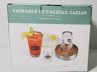 Photo of the boxed 5-piece Caesar cocktail set, showing packaging with images of glasses, jigger, and rimmer tray.