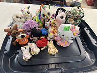 Photo showing 13 assorted child's stuffed plush toys including TY brand and Hello Kitty.