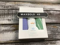 Boxed set of three Cloud Island muslin cotton baby blankets shown from front with visible colors and patterns through box window.